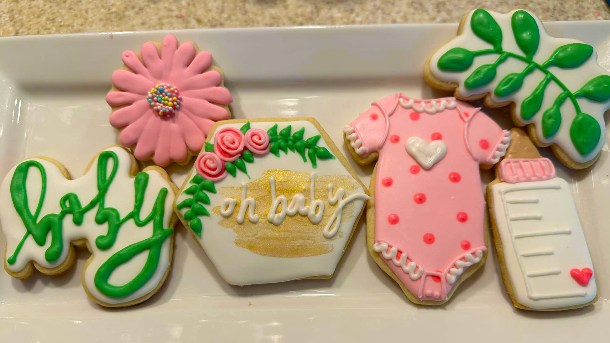 Baby Shower cookies.  Onesies, Baby bottle, Cursive "Baby"  - Phrase "Oh Baby" Plant Flower.  {Pink Green theme.)