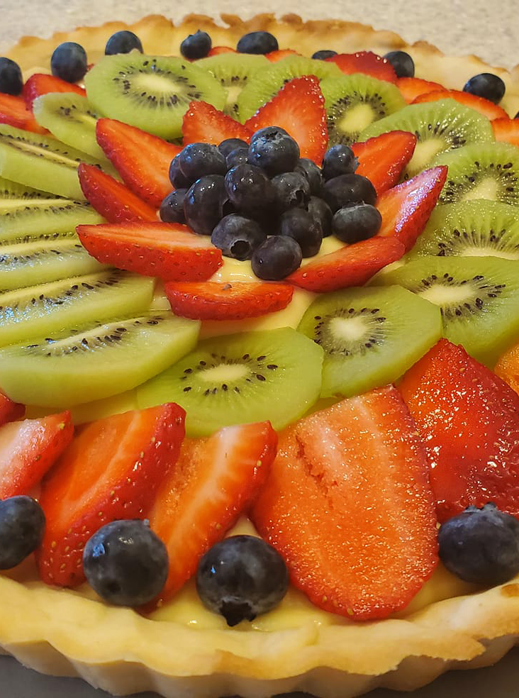 Fruit tart - Pie Strawberry, Blueberry, Kiwi on top with sugar glaze.