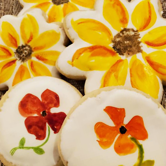 Watercolor Sunflower cookies and Pansies cookies.  Vanilla flavored.